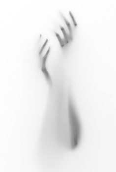 the shadow of a hand reaching up into the air