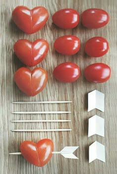 tomatoes, marshmallows and toothpicks arranged in the shape of hearts