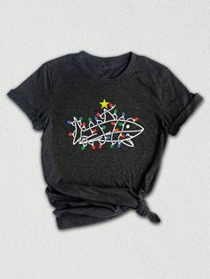 Elevate your holiday wardrobe with our whimsical Christmas shirt, perfect for spreading good cheer! This Christmas outfit features an adorable design showcasing your favorite Christmas animal, sure to bring smiles to family and friends. Ideal for seasonal gatherings, this shirt is not just a piece of clothing; it's a delightful Christmas gift shirt that captures the spirit of the season.  Celebrate the joy of the Holidays with our funny Christmas shirt, featuring a playful Christmas shark tee that's sure to be a hit at any Christmas holiday event. The vibrant colors and festive details of Christmas lights and a beautifully decorated Christmas Tree make this shirt a standout choice during the Most Wonderful Time of the Year! Whether you're lounging at home or attending a holiday party, our Matching Holiday Shirts, Fun Christmas T-shirt For Holiday, Casual Crew Neck Holiday Shirt, Fun Christmas Graphic Print Tops, Cute Holiday T-shirt With Crew Neck, Casual Christmas Tops With Funny Print, Holiday Graphic Tee With Crew Neck, Family Matching Holiday Tops With Graphic Print, Holiday Funny Print Short Sleeve Top