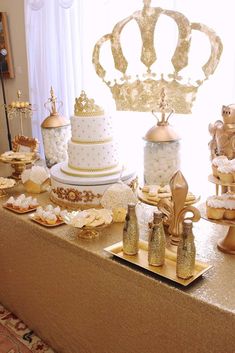 a table topped with lots of cakes and desserts