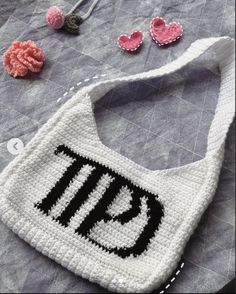 a crocheted bag with the letter p on it