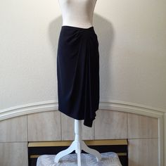 Black Crepe Like Fabric Gathered To Top Right With A Long Drape Zips At Side Gorgeous, Dress Down Or Up Excellent Condition, New With Tags Size: 10 Approx.: 16' Across At Waist / 20' Across At Hip Area / 26' Length (The Drop Is 28') Measured From Waist To Hem Black Formal Draped Skirt, Black Relaxed Draped Skirt For Formal Occasions, Black Formal Relaxed Draped Skirt, Black Draped Long Skirt For Formal Occasions, Formal Black Relaxed Draped Skirt, Black Draped Bottoms For Evening, Elegant Black Draped Bottoms, Elegant Black Evening Wrap Skirt, Elegant Evening Black Wrap Skirt