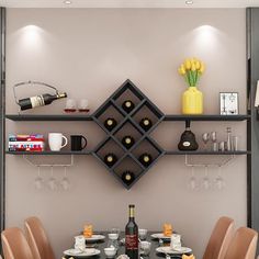 a dining room table and chairs with wine bottles on the shelves above it, in front of a wall mounted wine rack