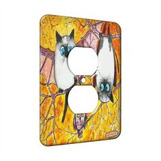 a light switch cover with two cats and bats on the front, one has blue eyes