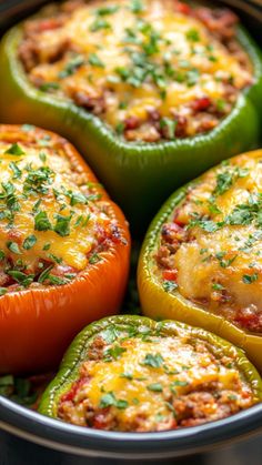 several stuffed peppers with cheese and herbs in a bowl