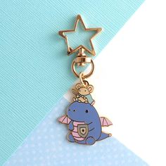 a keychain with an animal on it and a star hanging from the top