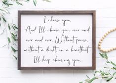 a wooden framed sign with the words i choose you and like those you never find