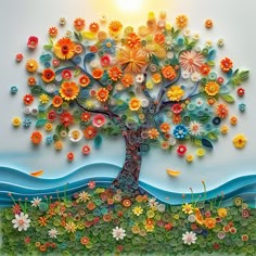 a colorful tree with flowers and birds on it's branches is featured in this paper art