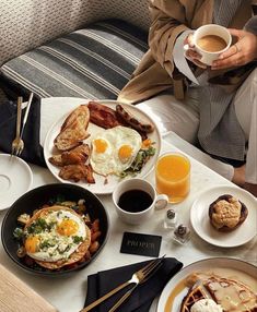 a table topped with breakfast foods and drinks