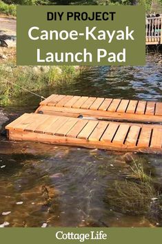 two wooden planks floating on top of a river next to a bridge with text that reads diy project canoe - kayak launch pad