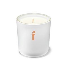 a white candle with an orange f on it