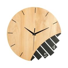 a clock made out of wood with numbers on the face and an arrow in the middle