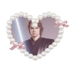 a star wars character is in the middle of a heart shaped frame with pearls around it