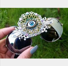 💙A great funky pair of sunglasses suitable for the festival girls and boys.... 💜This trippy pair of Third Eye Sunglasses are the perfect unusual accessory if you love something different. 💙The frames are silver lightweight and they have silver  mirrored lenses. In the centre of the glasses they have hand painted boho psychedelic metal embellishment in silver, gold and blue, iridescent ab rhinestones with a 'all seeing' third eye in the centre. 💜Great for festivals, carnivals, holidays, or everyday wear if that's your thing 😉 💙UV protection. 💜Exclusive design made by myself, you won't see any others like these anywhere else. 💙All my glasses come in a black pouch to keep them safe, please also handle with care. 💜Checkout the full collection of Sunglasses here :  https://www.etsy.com Third Eye Sunglasses, Funky Clothing, Mirror Clothes, Festival Girls, Eye Round, Brown Accessories, Black Jewel, Funky Outfits, Unisex Sunglasses