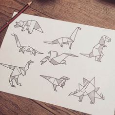 an image of some origami dinosaurs on paper