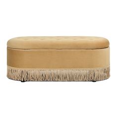 a tan bench with fringe trim around it