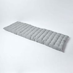 an image of a sleeping bag laying on the floor in front of a white background