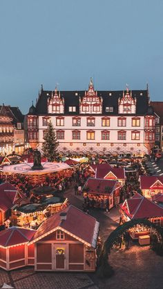 an aerial view of the christmas market at dusk