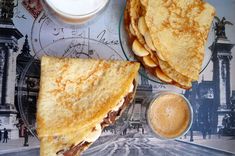 two quesadillas on a plate with dipping sauce