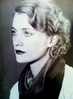 an old black and white photo of a woman