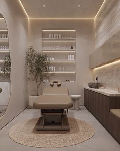 a spa room with a large mirror, sink and massage table in the middle of it