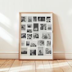 a wooden frame with multiple photos on it in front of a wall full of white walls