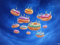 there are many donuts with candles on them