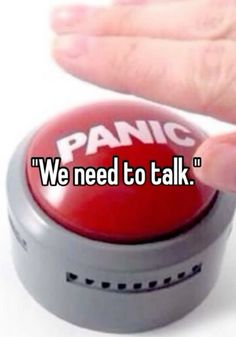 someone touching a red button that says panic we need to talk