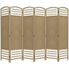 a room divider made out of wicker with white trimmings on the sides