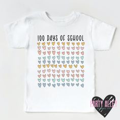 a white shirt with hearts on it that says 100 days of school