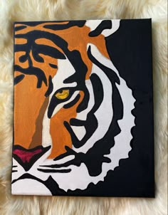 a painting of a tiger's face on a black and white background with yellow eyes