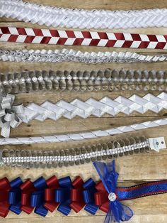 several different types of ribbons on a wooden table