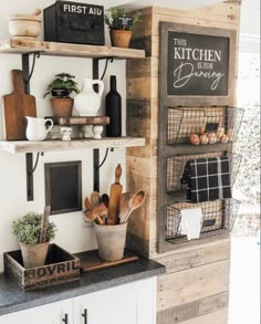 the kitchen is decorated in rustic style with wood and metal shelvings, potted plants, and wooden utensils