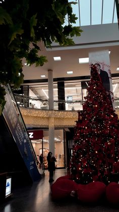 a large christmas tree in the middle of a mall