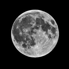 the full moon is shown in black and white