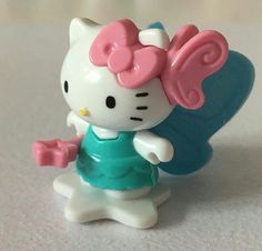 a hello kitty figurine is shown on a table