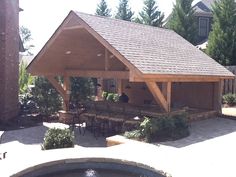 a gazebo with tables and chairs around it