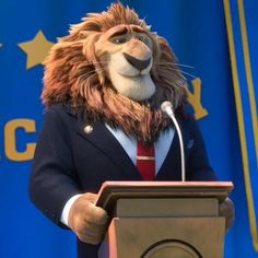 a lion in a suit and tie standing at a podium