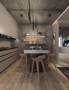 a modern kitchen with wooden floors and white counter tops is pictured in this image, there are two stools at the center of the table