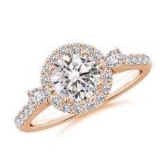 a rose gold engagement ring with an oval diamond center