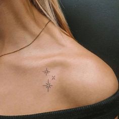 a woman with a small tattoo on her chest