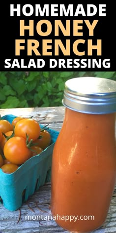 homemade honey french salad dressing with fresh tomatoes in a blue container on a picnic table