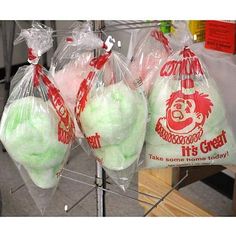 three bags filled with green stuff sitting on top of a table next to each other