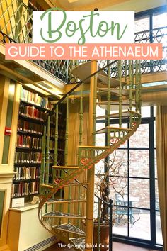 a spiral staircase in the middle of a room with bookshelves and windows behind it