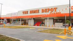 an orange and white store front with the words home depot on it