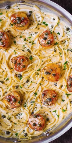 a pan filled with pasta covered in sauce and toppings