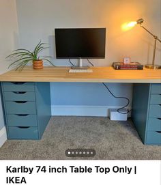 a desk with drawers and a computer on it