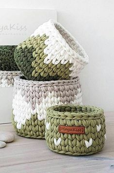 four baskets are stacked on top of each other