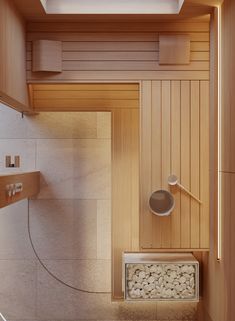 the inside of a sauna with wood paneling and white stone flooring is shown