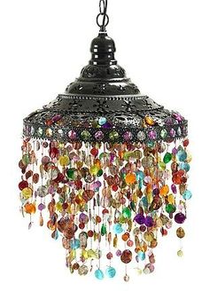 an image of a chandelier with many colorful beads hanging from it's ceiling